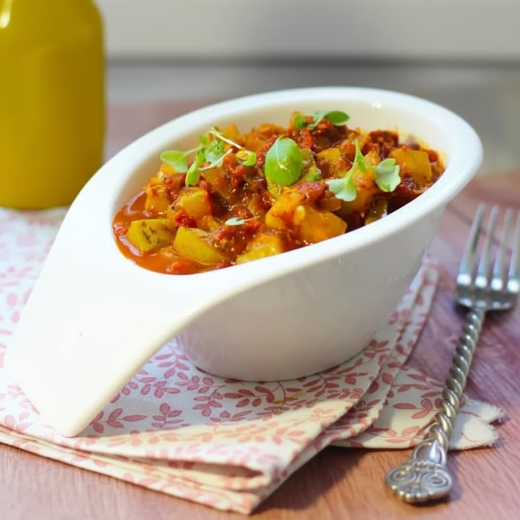 Кабачки в соусе из томатов и печёного перца